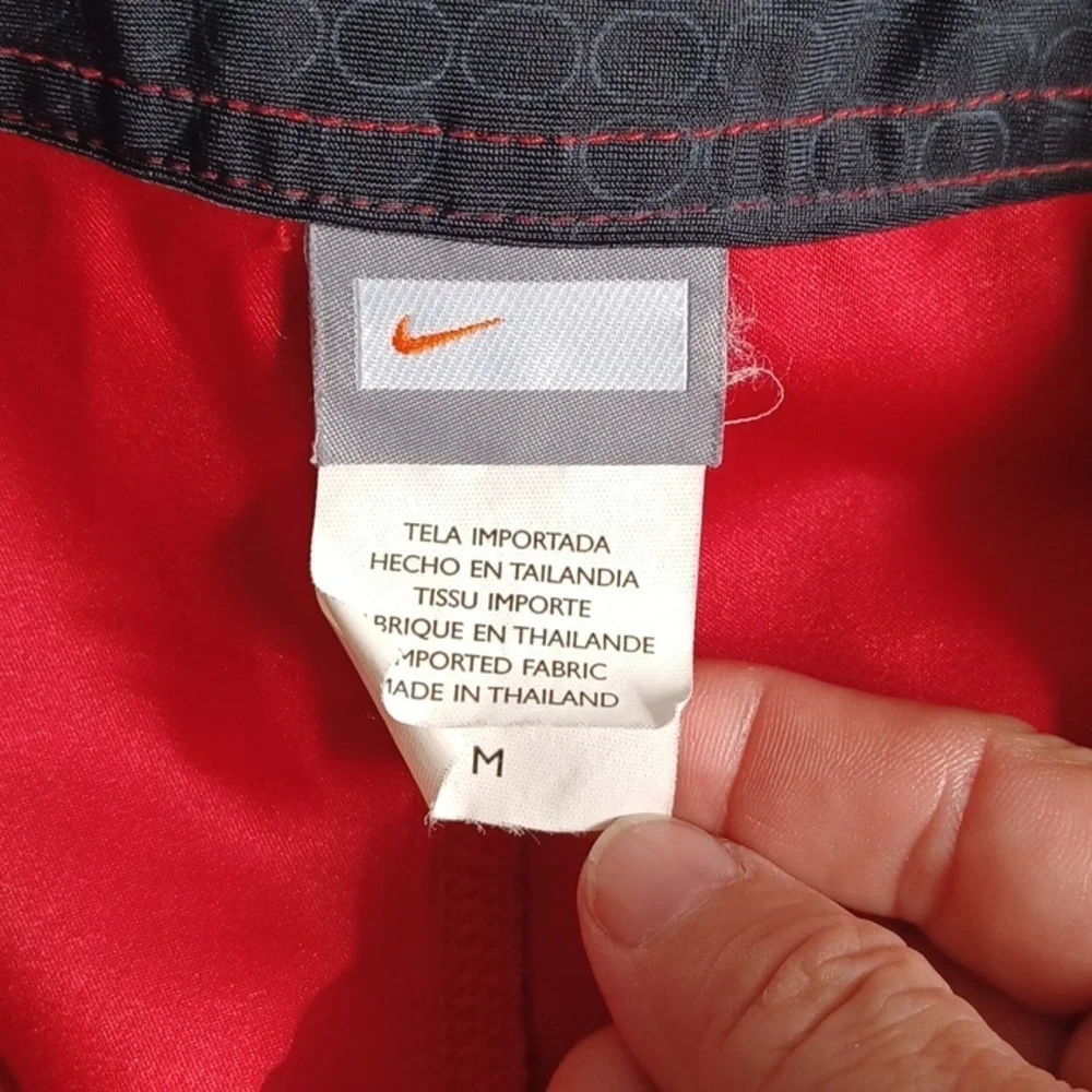 Red Nike swim shorts, Jr size medium